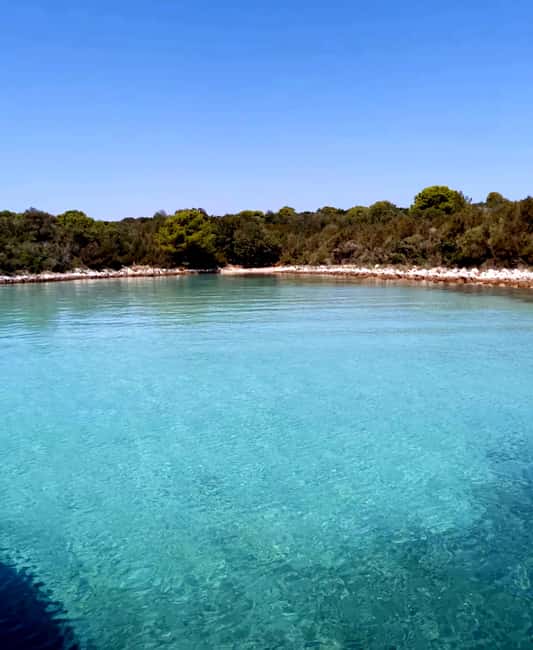 Zadar: Half-Day Island-Hopping and Lagoons Cruise with Fruit - Ugljan Island Beach Time for Sand Between Your Toes